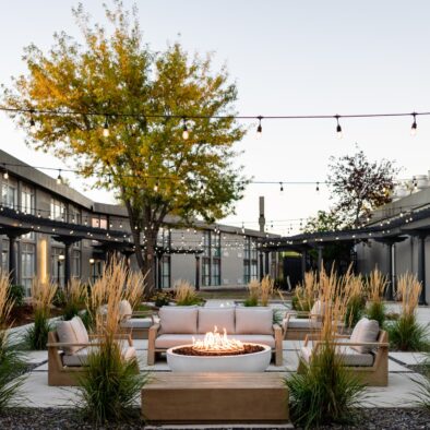 Outdoor courtyard fire pit and lounge seating at Riverside Hotel, Casper WY