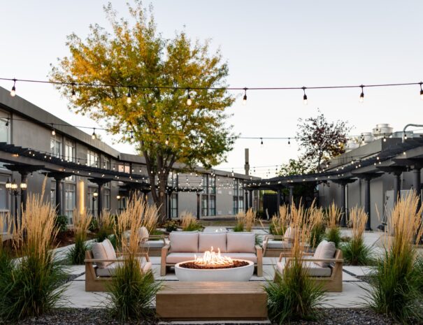Outdoor courtyard fire pit and lounge seating at Riverside Hotel, Casper WY